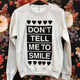 Image for article titled We Need This 'Don't Tell Me to Smile' Sweatshirt